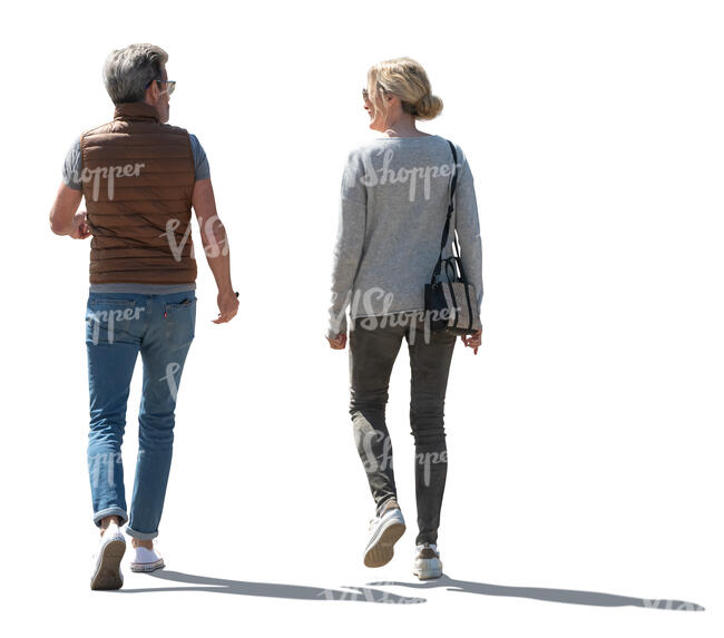 two cut out backlit people walking