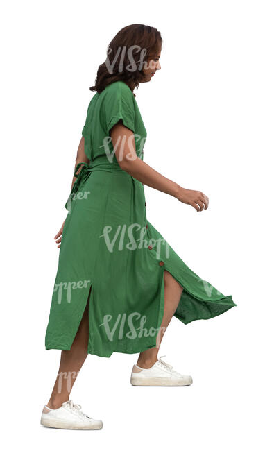 cut out woman in a green dress walking up the stairs