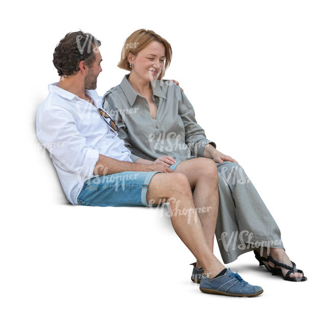 cut out couple sitting on a sofa