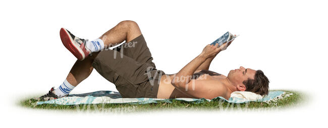 cut out man sunbathing in the park and reading a book