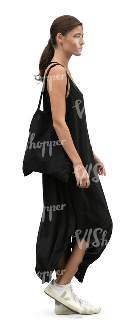 cut out woman in a black dress walking in side view