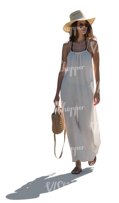 cut out woman in a white beach dress walking in backlight