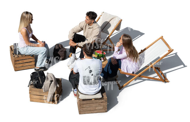 top view of a group of youngsters hanging in a outdoor cafe