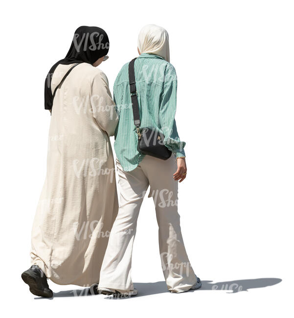 two muslim women walking in the street