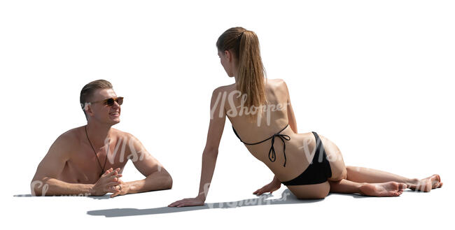 man in the pool talking to a woman sunbathing