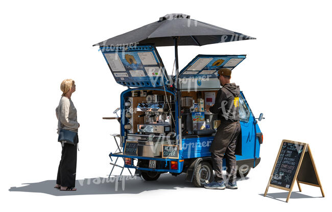 woman buying coffee from a street vendor