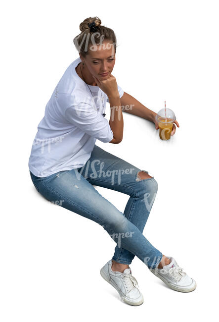 top view of a woman sitting and drinking smoothie