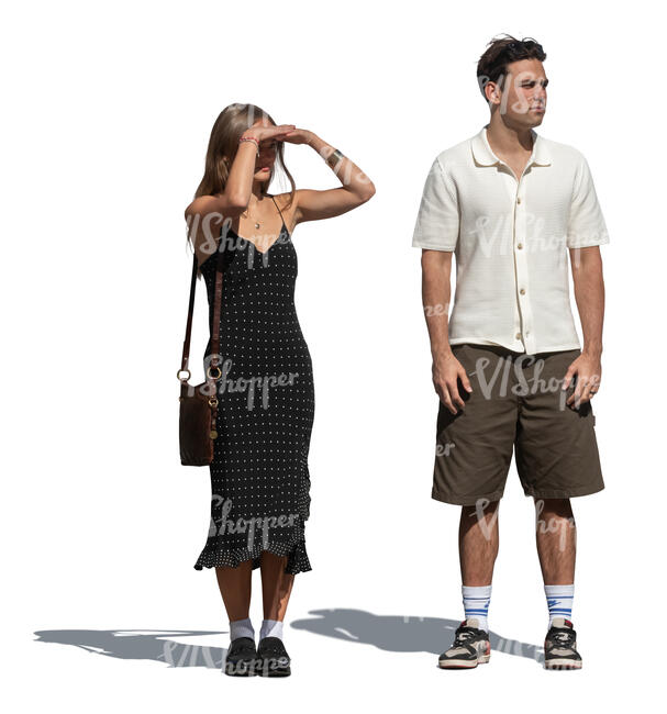 two cut out people standing and looking into distance