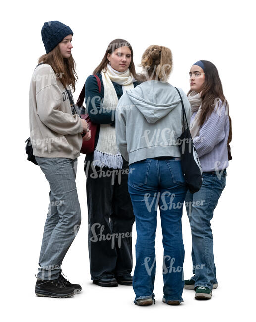 four women standing in the street in a group
