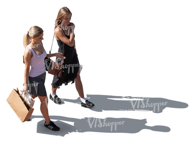 top sidelit view of two young women walking