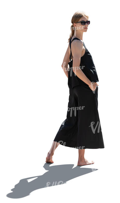 cut out woman standing in backlight and looking back over her shoulder