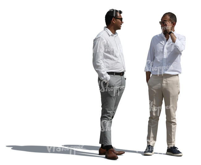 two men in white shirts standing and talking