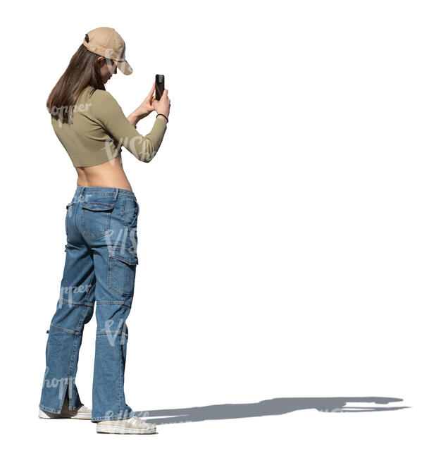 cut out woman with a baseball cap taking photos