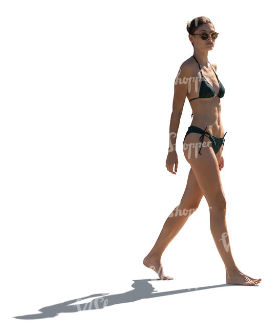 cut out backlit woman at the beach walking