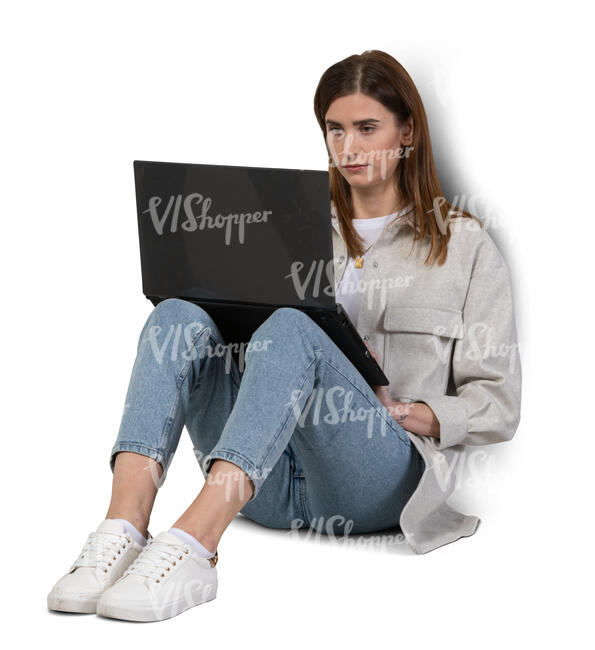 woman sitting on the floor with a laptop
