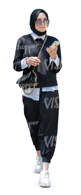 young muslim woman with a hijab walking