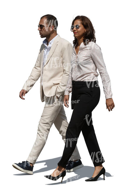 man and woman in formal summer outfits walking
