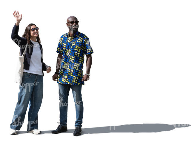 two people waiting to meet a friend and waving