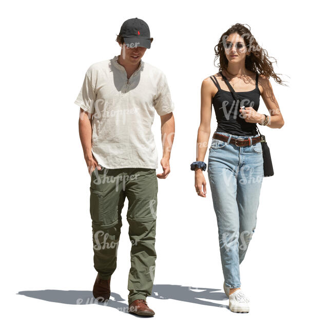 two cut out people walking outside in the street