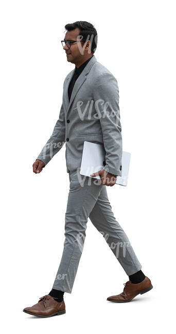 cut out indian businessman in a grey suit walking