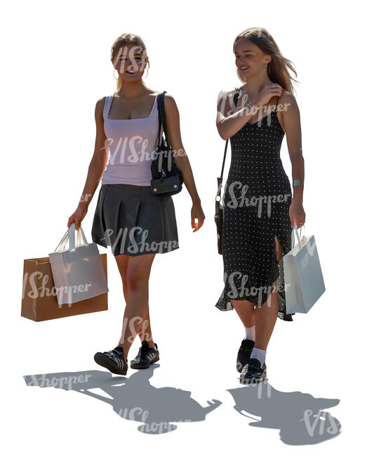 two cut out backlit teenage girls coming from shopping