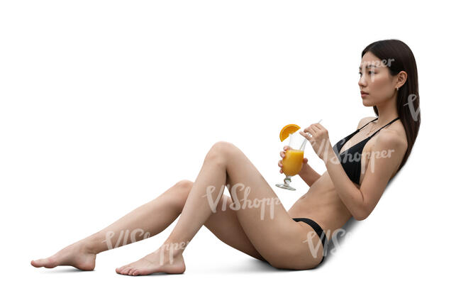 asian woman sunbathing and drinking a cocktail
