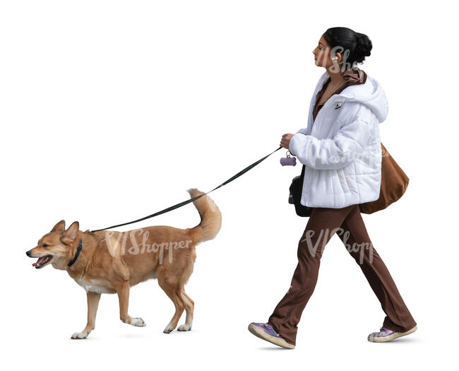 woman with a white winter jacket walking a dog