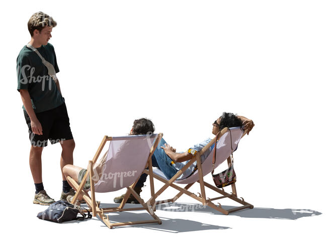 man talking to two friends sitting in outdoor chairs