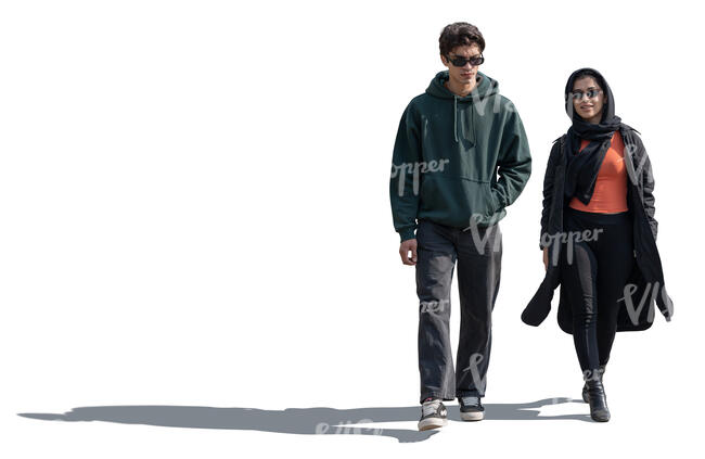 middle eastern man and woman walking