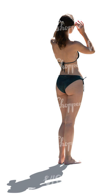 cut out backlit woman in a bikini standing