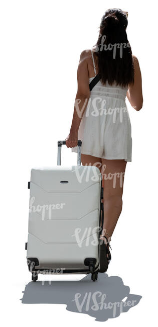 woman in a light summer outfit walking with a large suitcase
