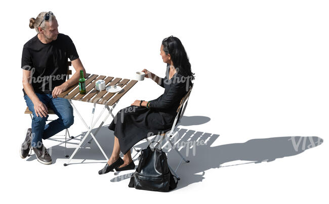 man and woman sitting and drinking coffee seen from above