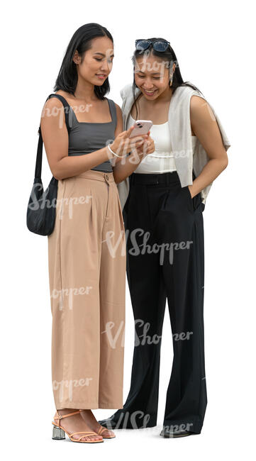 two asian women standing and looking at a phone together