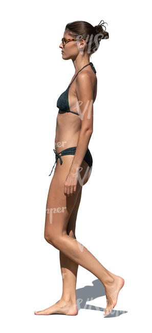woman in a bikini walking in side view