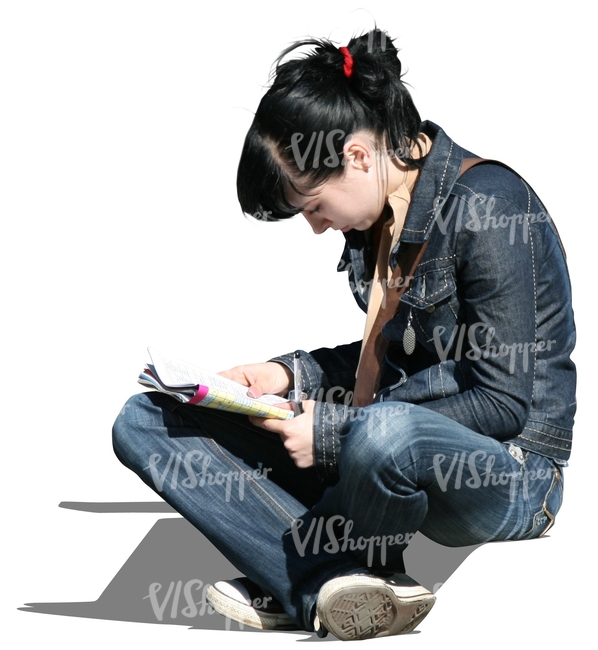 young woman sitting and reading a newspaper