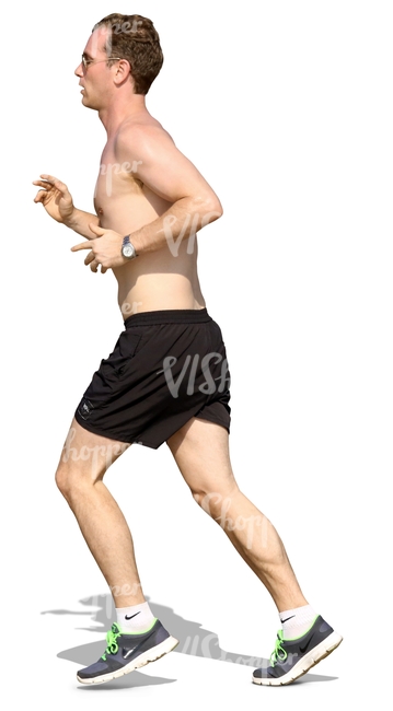 man in shorts jogging on the beach