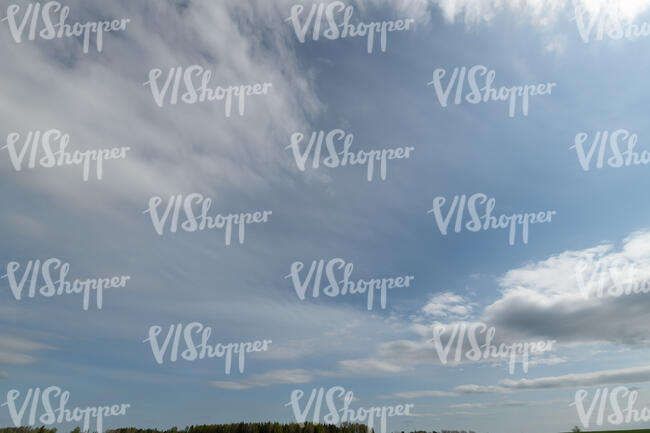 daytime sky with cirrus and cumulus clouds