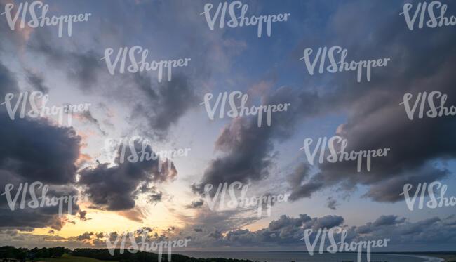 sunset with clouds and pink and yellow sky